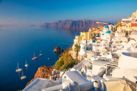 Photo for Famous Panoramic view of Santorini, Greece. White architecture, yachts and the blue sea of the island of Santorini against the background of the sea. Holidays in Greece, Santorini. - Royalty Free Image