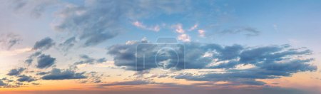 Photo for Extra wide panorama of the sunset sky. Light colored clouds. No birds in the sky. Sunrise Sundown Sunset sky panoramic image - Royalty Free Image