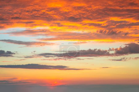 Photo for Dramatic sunrise against a sky with colorful clouds.  Real sunset, dawn. Without any birds. Large. This is real dawn cloudscape - Royalty Free Image