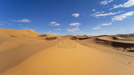 Photo for Sunset light and footprints in the desert of Merzouga in Morocco - Royalty Free Image