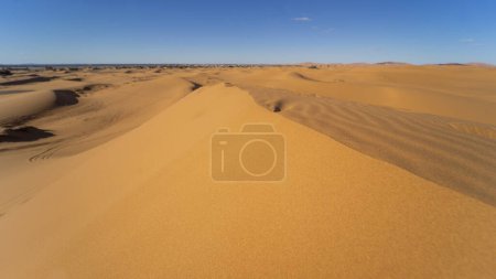 Photo for Sunset light and footprints in the desert of Merzouga in Morocco - Royalty Free Image