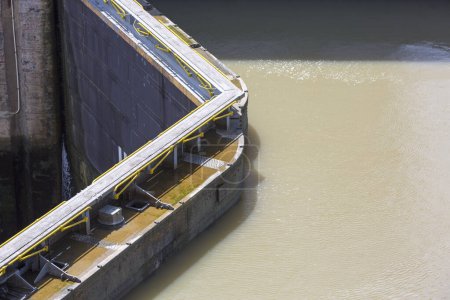 Photo for Gates and basin of Miraflores Locks Panama Canal filling to raise a ship. Panama City, Panama 2014. - Royalty Free Image