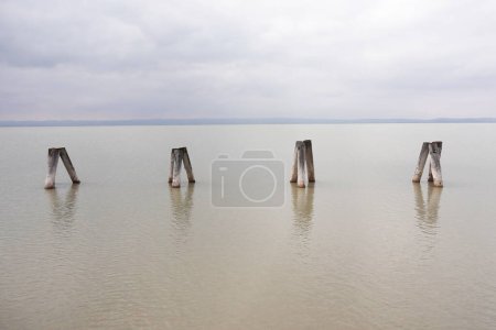 Lake Neusiedl calm water in early spring with cloud moody sky