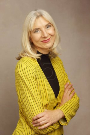 Beautiful blond lady in her 50s professional portrai personal branding shot