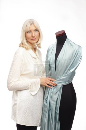 dress maker posing over white