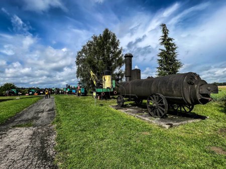 Photo for An exhibition of old steam engines on the square next to the historic silver mine in Tarnowskie Gory Locomotive steam boiler. - Royalty Free Image