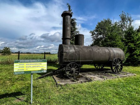 Photo for An exhibition of old steam engines on the square next to the historic silver mine in Tarnowskie Gory. Locomotive steam boiler. - Royalty Free Image