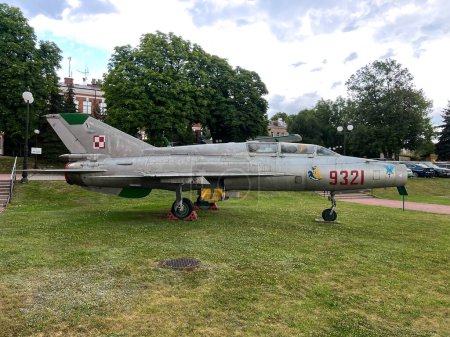 Photo for The MIG 21 UM jet aircraft standing on the square in front of the Aviation Center of the Polish Academy of Sciences in Chelm. Poland. - Royalty Free Image