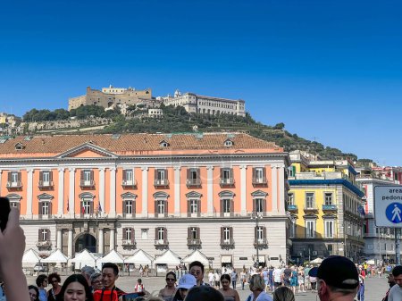 Photo for Naples, Italy - September 27, 2022: Palazzo della Prefettura or Prefectural Palace is a monumental palace located in the central Piazza del Plebiscito square in Naples. In the back is the medieval fortress of Castel Sant Elmo - Royalty Free Image