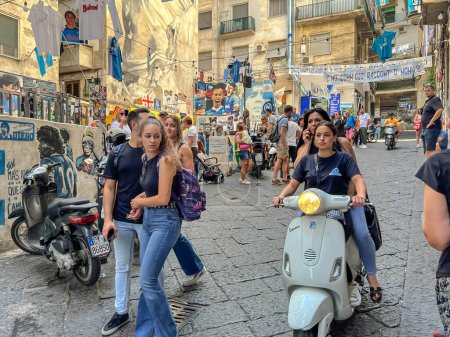 Photo for Naples, Italy, September 27, 2023: The Quartieri Spagnoli district in Naples with a mural of Diego Armando Maradona and a large number of shops related to football and the Napoli club. - Royalty Free Image