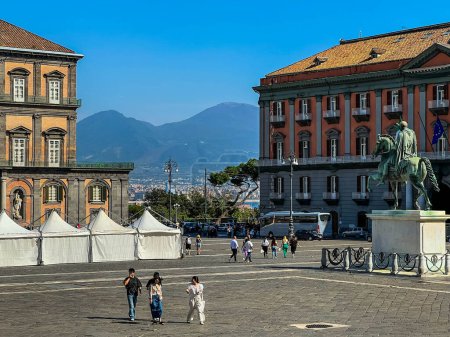 Photo for Naples, Italy, September 27, 2023: Monumental Plebiscite Square in Naples, Italy, with historic buildings and the outline of the Vesevius volcano in the distance. - Royalty Free Image