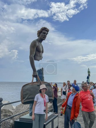 Photo for Amalfi, Salerno, Italy. September 26, 2023: "The travelers" of Bruno Catalano. The exhibition dedicated to the spiritual journey of everyone's life, but also to emigration. On the pier in Amalfi, Italy. - Royalty Free Image