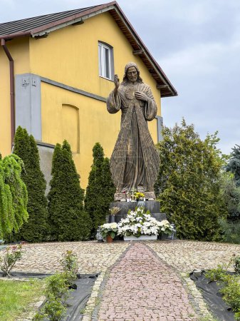 Figure of Merciful Jesus next to the church and cemetery in Gora Swietej Malgorzata (Mount of Saint Margaret) in Poland.