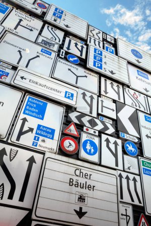 Téléchargez les photos : LUCERNE, SWITZERLAND - JULY 14, 2021: Display of various traffic signs on the exterior wall of the Swiss Museum of Transport in Lucerne, Switzerland. This museum exhibits all forms of transportation. - en image libre de droit