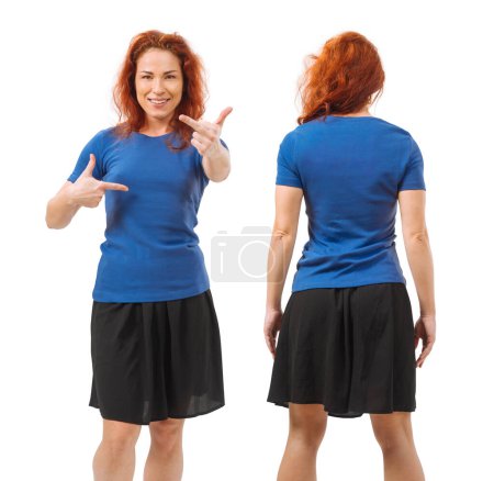 Photo for Photo of a young beautiful redhead woman with blank blue shirt, front and back. Isolated over white background and ready for your design or artwork - Royalty Free Image