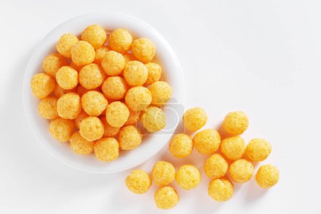 Photo for Top view of cheese puff balls on a plate on white background - Royalty Free Image