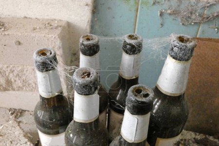 old bottles with spider web