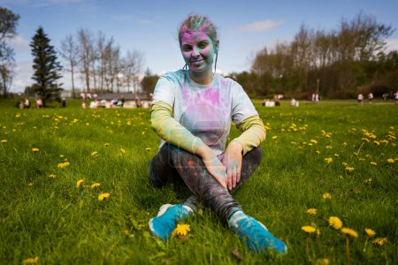 Photo for Portrait of happy European woman celebrating Holi with powder colors or gulal. Concept of Indian festival Holi. - Royalty Free Image