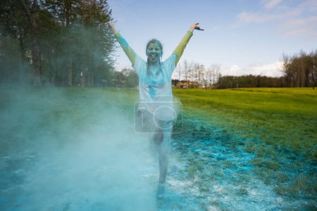 Photo for Portrait of happy European woman celebrating Holi with powder colors or gulal. Concept of Indian festival Holi. - Royalty Free Image