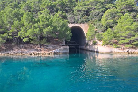 Photo for Submarine and ship bunker on Lastovo island, Croatia. Concrete bunker shelter for submarines in Adriatic sea. Travel on a yacht in Croatia. - Royalty Free Image