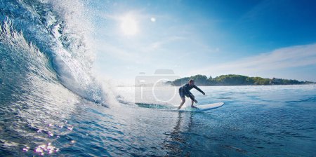 Photo for Surfer rides the ocean wave in the Maldives - Royalty Free Image