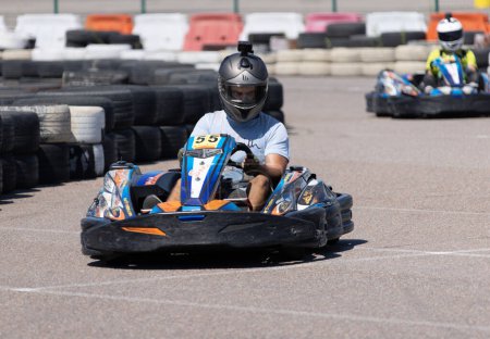 Photo for ODESSA, UKRAINE - August 7,2022: Extreme car racing. Healthy lifestyle. Tense moments of race. People are into motorsports. Karting. Hobbies, sport, recreation, lifestyle. Risk and excitement on court - Royalty Free Image