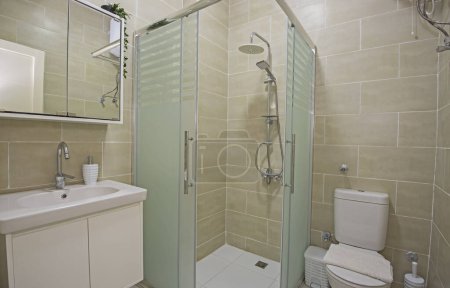 Interior design of a luxury show home bathroom with shower cubicle and sink