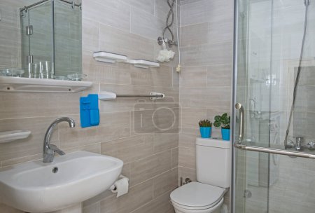 Interior design of a luxury show home apartment bathroom with shower cubicle and sink