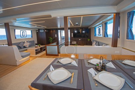 Interior design furnishing decor of the salon dining area in a large luxury motor yacht