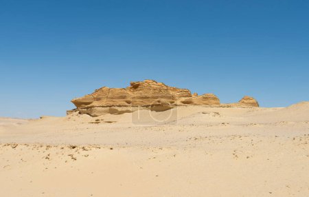 Landscape scenic view of desolate barren western desert in Egypt with geological mountain sandstone rock formations