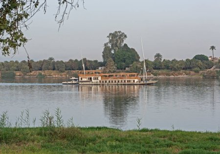 Large luxury traditional Egyptian dahabeya river cruise boat sailing on the Nile