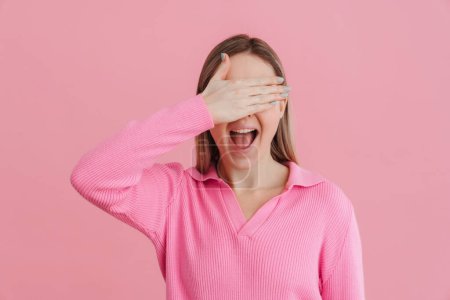 Photo for Young beautiful white woman wearing shirt smiling and covering her eyes standing isolated over pink background - Royalty Free Image