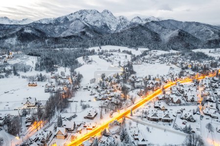 Winter landscape of Zakopane town and Tatra Mountains, drone view.