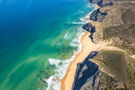 Aerial droe view of beautiful natural Cordoama beach in Portugal Atlantic coast