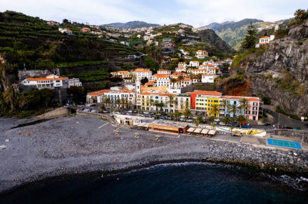 Photo for Ponta do Sol in Madeira Island, Portugal. Aerial drone view at cityscape of coastal town and beach - Royalty Free Image