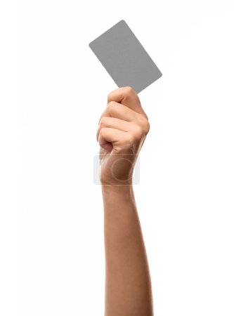shopping, finance and people concept - close up of hand with plastic credit card on white background
