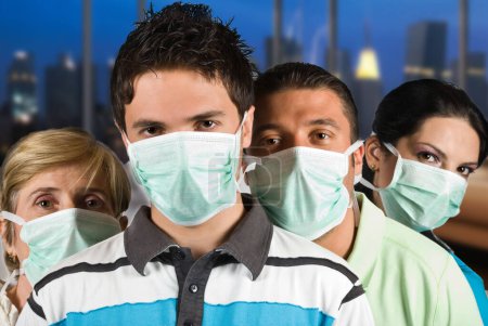 Group of three people young and mature wearing protective mask ,young man in front of image isolated on white background