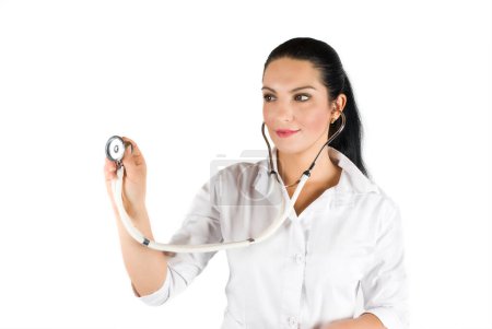 Beautiful female doctor with stethoscope on white background