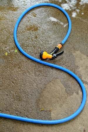 Photo for Car wash tool on ground, Water spray - Royalty Free Image