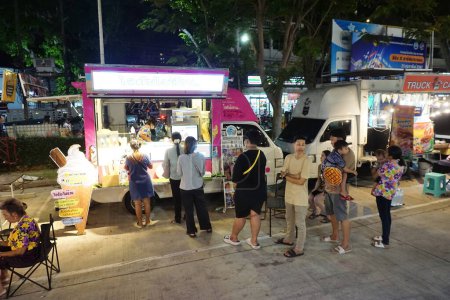 Photo for CHONBURI, THAILAND  - 24 APR : People waiting for order ice cream at food truck in Kong Kao Tradition event on 24 April 2024 in Siracha, Chonburi, Thailand - Royalty Free Image