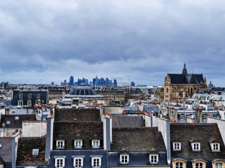 Foto de Panorama of Paris roofs with La Defense on background, France on moody day - Imagen libre de derechos