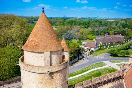Photo for Medieval castle tower and walls Blandy-les-Tours, France view from above towards village - Royalty Free Image