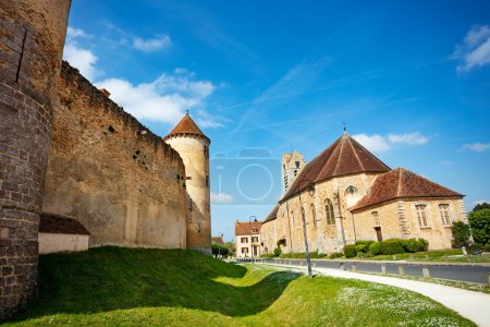 Photo for Saint-Maurice church and walls of Blandy-les-Tours castle is a in the Seine-et-Marne department in the Ile-de-France - Royalty Free Image