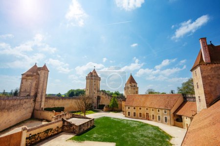 Photo for Big court with tower and walls of Blandy-les-Tours castle on sunny day, France Europe - Royalty Free Image