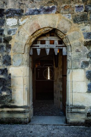 Photo for Big stone gates of Blandy-les-Tours medieval castle with wooden door - Royalty Free Image