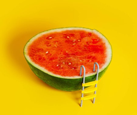 Téléchargez les photos : Juicy concept - watermelon fruit with pool ladder hot summer vacation allegory - en image libre de droit