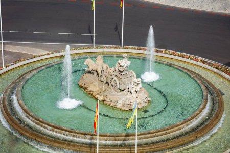 Photo for Fountain or Fuente de Cibeles 18th century neoclassical monument depicting the goddess Cybele on a chariot pulled by 2 lions on the square in Madrid view from above, Spain - Royalty Free Image