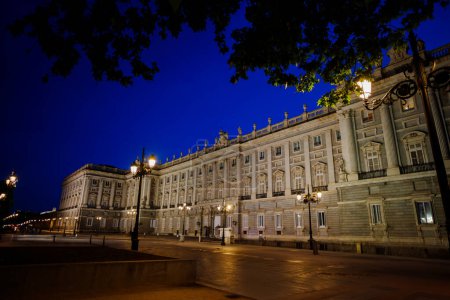 Photo for Royal Palace of Madrid building from Plaza de Oriente town square at night illuminated by lights - Royalty Free Image