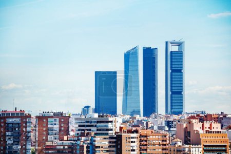 Panorama of Madrid Four Towers or Cuatro Torres Business Area over residential buildings on foreground