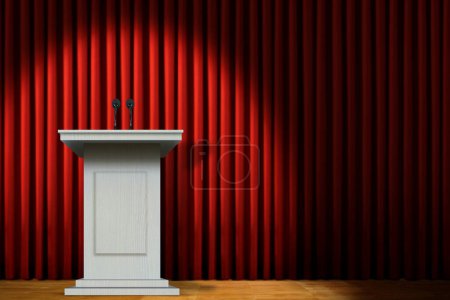 Foto de White podium on stage under spotlight over red curtain - Imagen libre de derechos